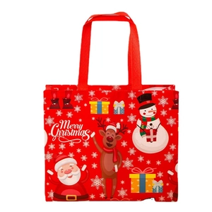 Red Christmas non-woven gift bag with festive Santa, snowman and reindeer prints