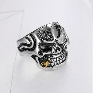 Classic stainless steel skull ring with golden pipe detail and crystal eye inlay