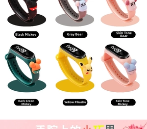 Detail view of colorful waterproof LED digital watches with cartoon 3D character charms