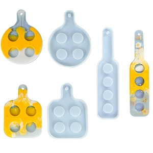 Detail showing silicone molds and finished resin trays in yellow and white marble effects
