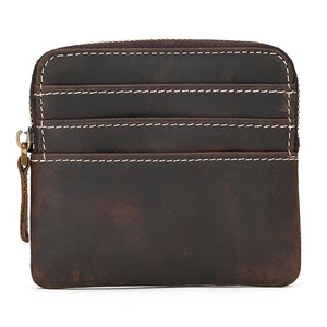 Detailed view of dark brown crazy horse leather coin purse with contrast stitching and zipper