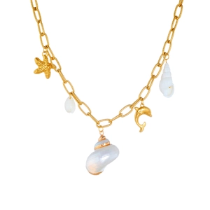 Bohemian gold chain necklace with starfish, dolphin and seashell charms on white background