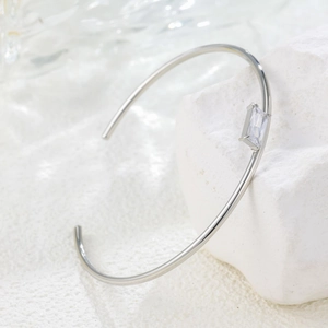 Minimalist silver stainless steel open bangle with baguette cut zircon gemstone