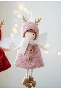 Detail of plush Christmas angel pendant with pink dress, brown antlers, and wooden button