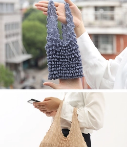 Detail of grey-blue and beige pleated bubble tote bags with elastic textured fabric