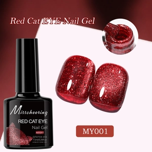 Macro shot of red cat eye nail gel texture with magnetic shimmer and brush detail