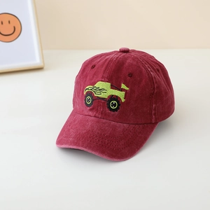 Detail of embroidered monster truck on burgundy velvet children's baseball cap