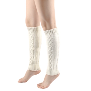 Detail of cable knit texture on cream white leg warmers for a cozy winter look
