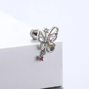Silver titanium butterfly key stud earring with pink and yellow zircons on white block