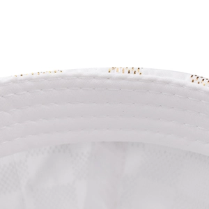 Detail view of white satin baseball cap with parallel stitching and gold pattern