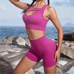 Hot pink seamless rib-knit workout set with cutout sports bra and high-waist shorts