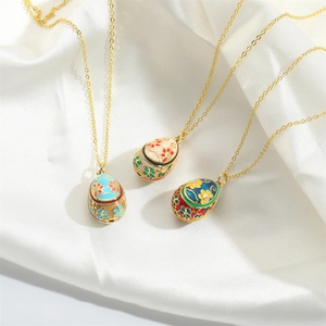 Vintage enamel egg pendant necklace set with colorful floral engraving on gold chains