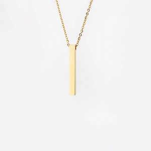 Detail of polished gold vertical bar pendant with rounded edges on a thin necklace chain