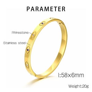 Detail showing 58x6mm gold stainless steel evil eye bangle with rhinestones