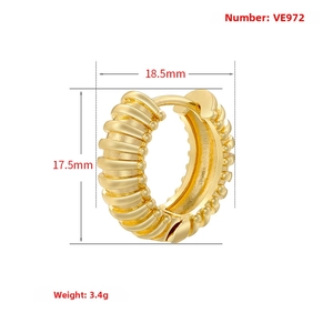 Detail view of gold U-shaped earring with thick textured thread design and dimensions