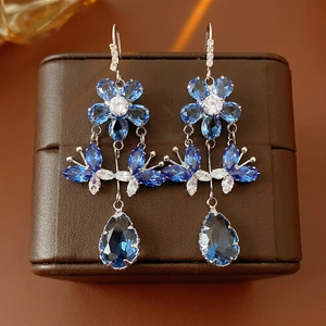 Elegant silver flower butterfly tassel earrings with blue and white zircon stones
