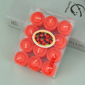 Macro detail of twelve red tea light candles in a transparent box with strawberry label