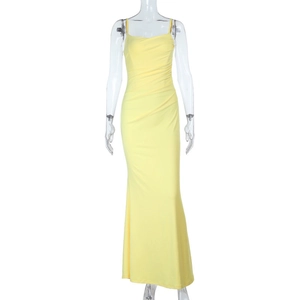 Detail showing bright yellow backless dress with fine ruching and mermaid hemline