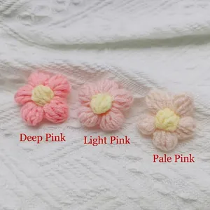 Three handmade crochet cotton flowers in gradient pink shades for DIY accessories