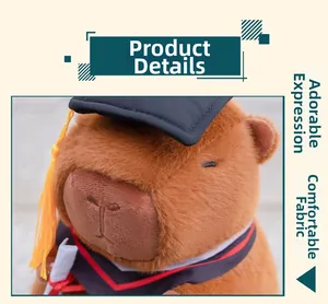 Close-up of a capybara plush wearing a graduation cap and gown with a diploma