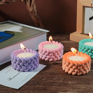 Cylindrical knit texture scented candles in purple pink orange and green colors