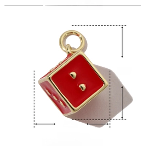 Detailed view of red enamel heart dice pendant with copper base and size measurements
