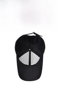 Detail of the internal structure of a black cotton baseball cap with adjustable metal buckle