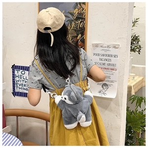 Detailed view of the cute husky plush backpack worn on a casual day out outfit