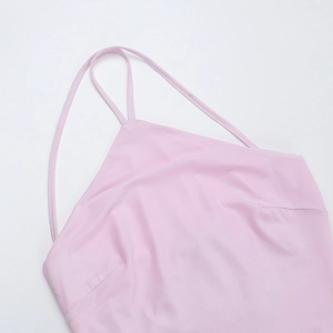 Detailed close-up of pink neck strap and fine textured fabric on the backless dress