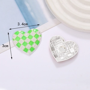 Green checkered heart DIY jewelry accessory with pearl dots and silver metal backing