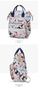 Detail of printed diaper backpack showing colorful horse patterns and spacious side pockets