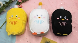 Detailed plush pouches in yellow, white, and black with cute chick facial embroidery
