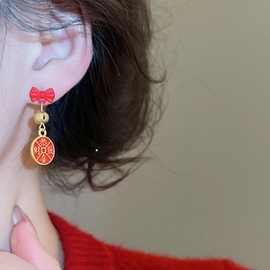 Detail view of New Chinese style red bow earrings with lucky greeting pendant for women