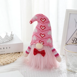 Gnomo di San Valentino rosa con cappello a maglia con cuori e fiocco rosso decorativo