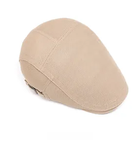 Top view of breathable beige mesh newsboy cap with adjustable metal buckle detail