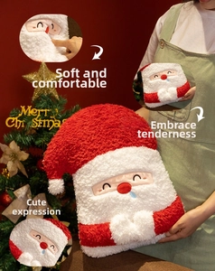 Close-up of Santa Claus plush pillow featuring soft lamb wool texture and festive embroidery