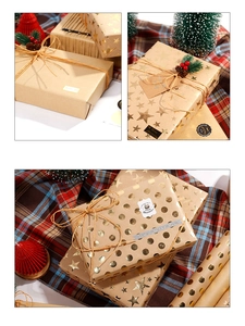 Detail of Christmas waterproof kraft wrapping paper with gold foil stars and festive labels
