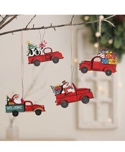 Set of four vintage red wooden truck ornaments with festive Santa and pine tree details