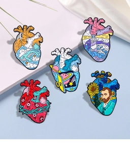 Macro shot of 5 unique enamel heart pins featuring lighthouse, ocean and Van Gogh motifs