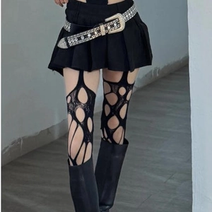 Sexy black fishnet stockings with irregular distressed holes and punk style design