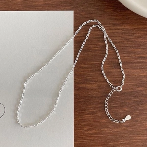 Minimalist 925 sterling silver anchor chain necklace with S925 tag on wooden background