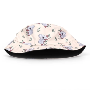 Detailed view of the double-sided bucket hat featuring cute koala prints and black lining