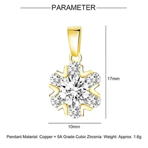 Sparkling gold snowflake pendant with cubic zirconia inlay measuring 17mm by 10mm