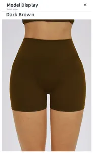 Detail of high waisted dark brown seamless yoga shorts with vertical ribbed texture