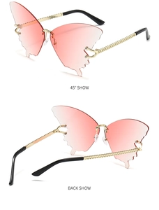 Detail of rimless butterfly sunglasses with gradient lenses and golden chain temples