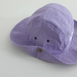 Purple quick-dry kids bucket hat with heart detail and side buttons for outdoor sun protection