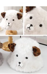 Detailed close-up of fluffy white faux rabbit fur bucket hat with cute bear ears and face