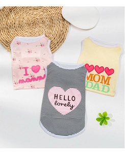 Flat lay showing three breathable summer dog vests in pink floral, stripe, and yellow patterns