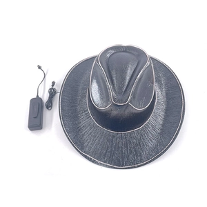 Detail of black LED cowboy hat with textured surface and visible battery power pack