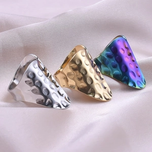 Three-piece set of wide shield rings with hammered texture in silver gold and rainbow